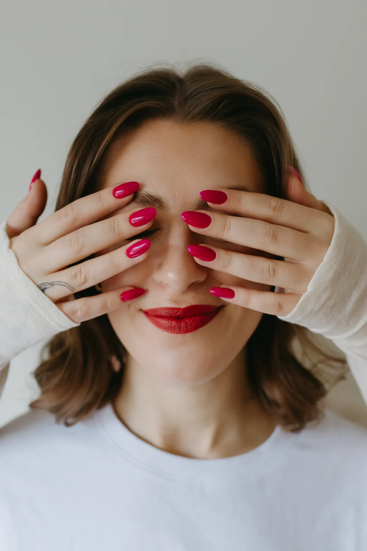 Hand-painted floral nail art with gold leaf at Take My Hand Toronto